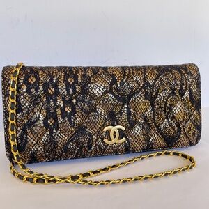 CHANEL Black and Gold Lace-Effect  Clutch with chain